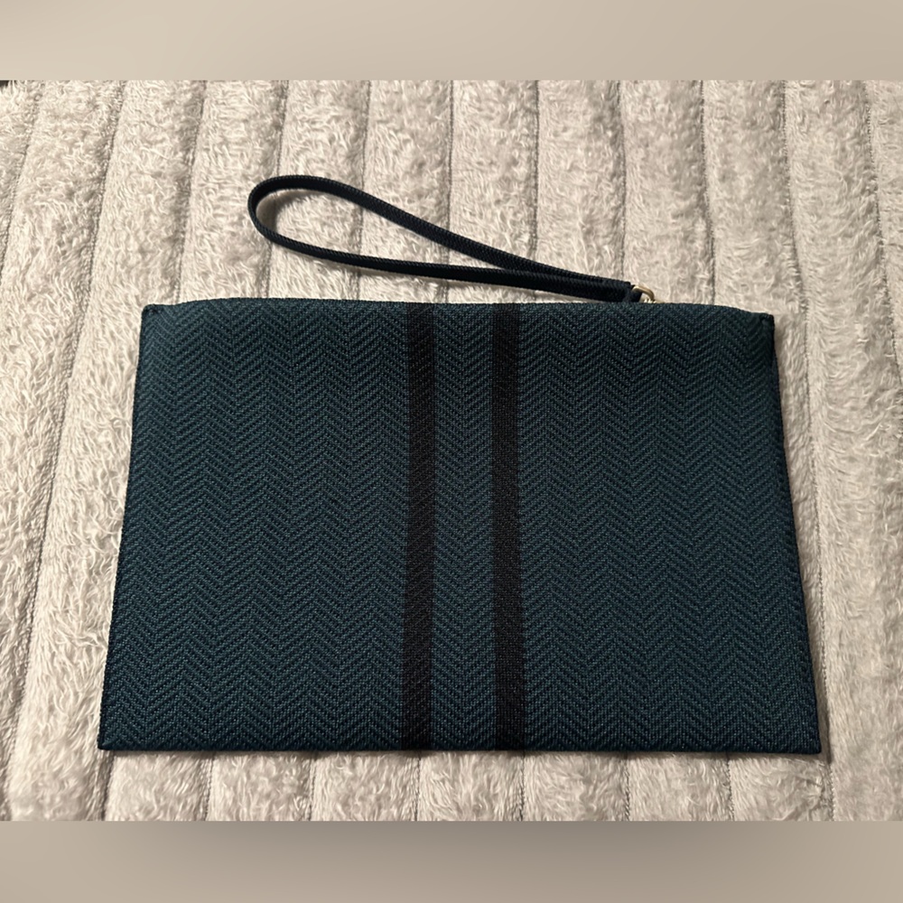 Rothy's The Wristlet pouch in herringbone green and black pattern